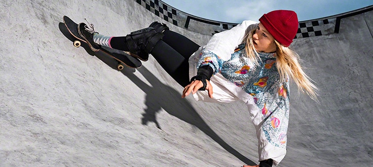 Image of woman on skateboard at skate park