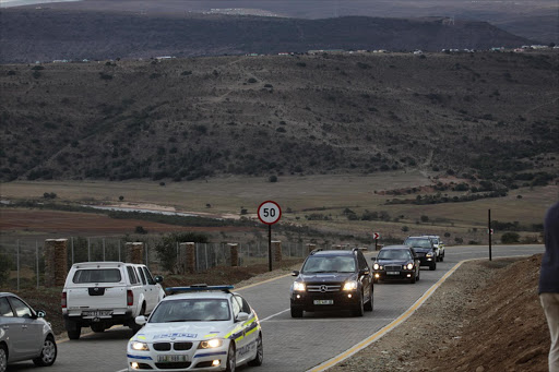 A Police convoy including a hearse drives into Mandla Mandela's royal palace in mvezo to collect the remains of three Nelson mandela's chieldren Photo:Johnny Onverwacht