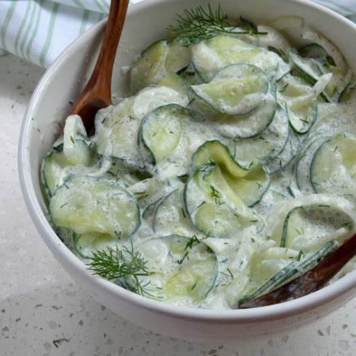 A delicious sour cream based German Cucumber Salad with onion made in less than fifteen minutes.  It is perfect for all your summer picnics, family reunions, and potlucks.