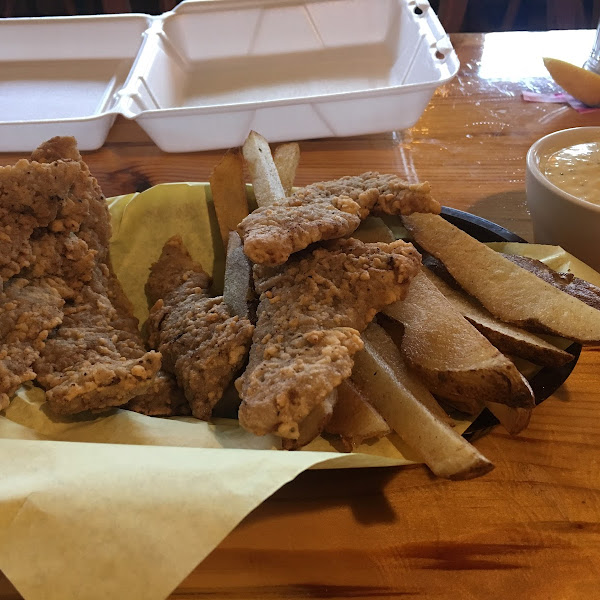 Gluten free chicken fried steak strips, fries and the best gluten free cream gravy. I get 2 meals out of this...see the to go box waiting. highly suggest adding an order gf fried zucchini/squash.