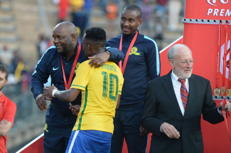 A file photo of coach Pitso Mosimane with midfielder Teko Modise celebrating during the Absa Premiership match between Mamelodi Sundowns and Platinum Stars at Lucas Moripe Stadium on May 21, 2016 in Pretoria, South Africa. Modise has since left Sundowns for Cape Town City FCX.