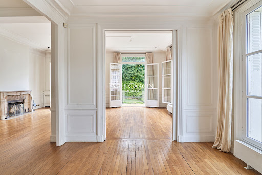 living room with fireplace and garden view - Luxury property for sale in Neuilly-sur-Seine, 7 rooms, 5 bedrooms