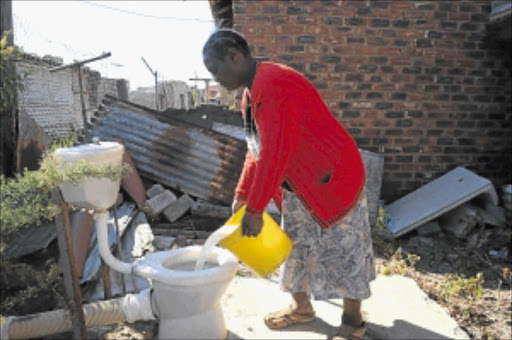 DAILY ROUTINE: Legedia Matee says she has lost hope that the council will one day complete building her toilet. PHOTO: TSHEKO KABASIA