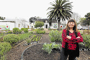 Michele Carelse, the restaurant owner, in her garden at Organic at Heart in Plumstead