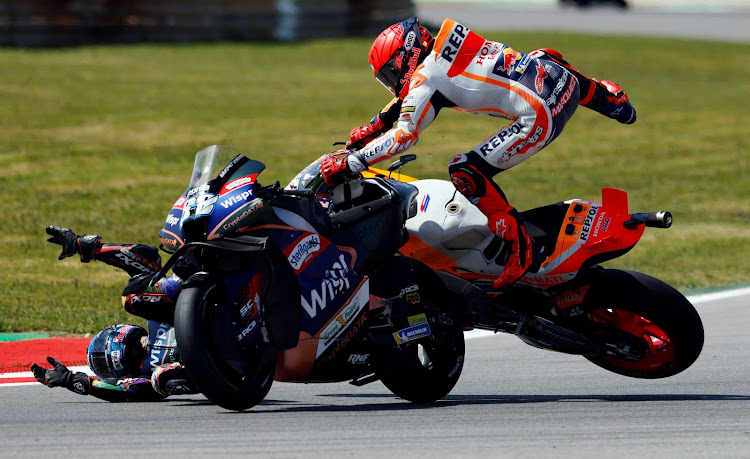 Marc Marquez and Miguel Oliveira crash out of the Portuguese MotoGP in March. Picture: REUTERS