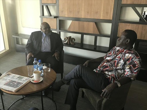 Opposition leader Raila Odinga and former Tanzanian president Benjamin Mkapa at the JKIA./FILE