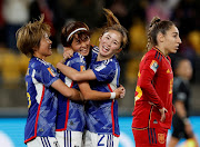 Japan's Hinata Miyazawa celebrates scoring their third goal with Risa Shimizu and Honoka Hayashi as Spain's Olga Carmona reacts in their Women’s World Cup group C match at Wellington Regional Stadium, New Zealand on July 31 2023.