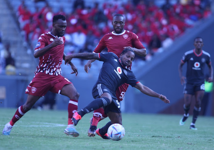 Orlando Pirates' Kermit Erasmus, fights for the ball possession with Sekhkhune United player Sibusiso Vilakazi during their DSTV/PSL match at Orlando Stadium in Soweto.