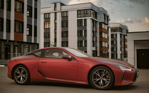 Photo of Red Coupe Parked in Pavement screenshot 1