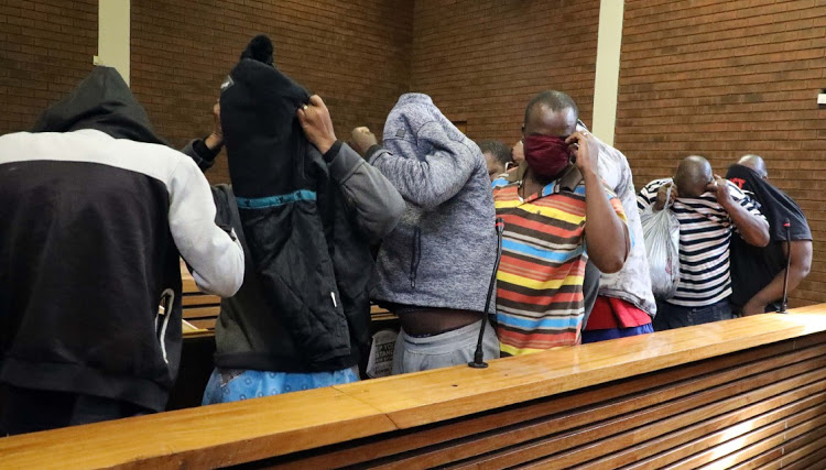 Some of the eight men accused of the murder of a bus driver Neho Motaung in Lawley during their appearance at the Lenasia Magistrate's Court.