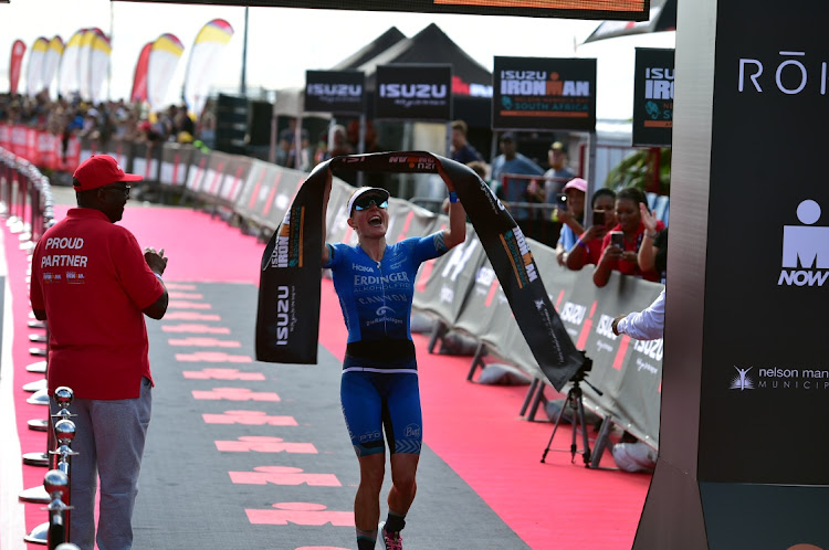 Gemany’s Daniela Bleymehl celebrates as she crossed the line to claim the 2022 Isuzu Ironman African Championship women’s title in Nelson Mandela Bay on Sunday