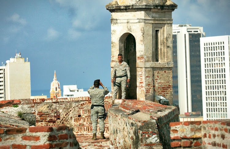 A Colombian soldier poses at Castillo San Felipe de Barajas in Old Cartagena, Colombia. 