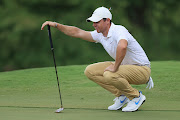 Rory McIlroy looks over a putt on the tenth green during the final round of the World Golf Championship-FedEx St Jude Invitational at TPC Southwind in Memphis, Tennessee, on August 02, 2020.