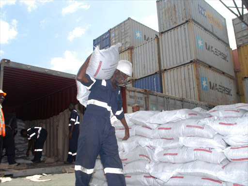 A worker offloads goods from a container at Portside Freight Terminal, February 6, 2016. /ANDREW KASUKU