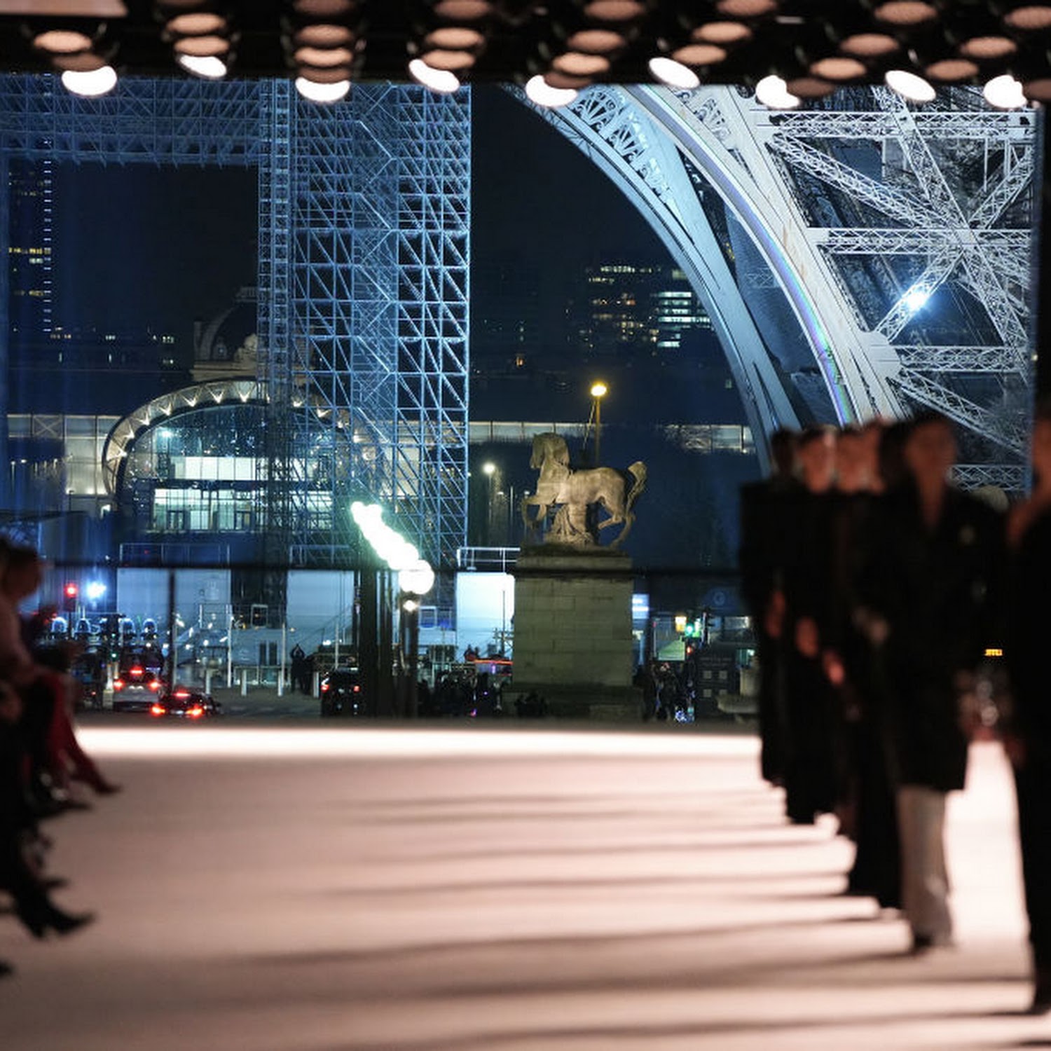 Yves Saint Laurent sends silky evening gowns down Eiffel Tower runway