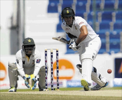 STUMPED: Proteas' Faf du Plessis bats as Pakistan's wicketkeeper Adnan Akmal crouches during the fourth day of their first test at the Sheikh Zayed Cricket Stadium in Abu Dhabi yesterday Photo: AFP PHOTO/STR/Gallo Images