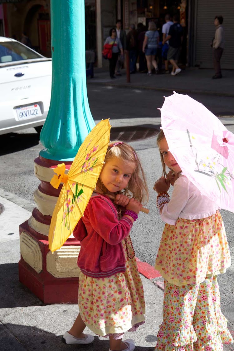 Girls with parasols in the Chinatown neighborhood of San Francisco