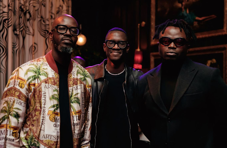 International DJ Black Coffee with his son Esona Tyolo and musician Tresor.