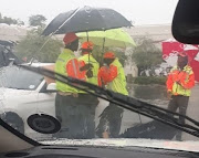 A group of car guards who did more than just guard the vehicle of a motorist who reportedly left two windows open ahead of a heavy downpour. 