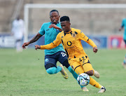 Mduduzi Shabalala of Kaizer Chiefs is challenged by Moses Mthembu of Richards Bay during their DStv Premiership match at King Zwelithini Stadium yesterday. 