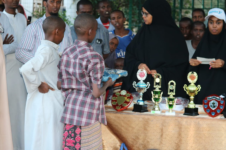 Members of Sisters of the Horn distribute sports kits to children from the Mandera Islamic Centre in Mandera town on August 9.