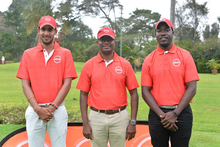 Team Kenya Pro Golfers Mohit Mediratta (R) and Daniel Nduva (L) Absa Corporate and marketing relations director, Moses Muthui (C) during the Pros sponsorship announcement.