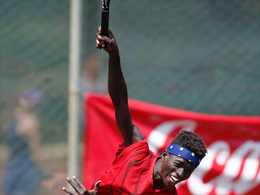 kenya’s Kevin Cheruiyot serves against Lalami Laaroussi and Cyrille Lago during their boys doubles semi finals during the ITF East Africa eighteen and Under Junior Circuit 2016 at Nairobi Club on January 22, 2016. Photo/Jack Owuor/www.pic-centre.com (KENYA)