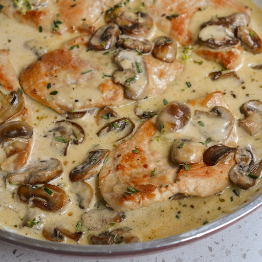 This Chicken and Mushroom dish comes together quickly in one skillet with boneless skinless chicken breasts, white buttons mushrooms, and a luscious creamy sauce.