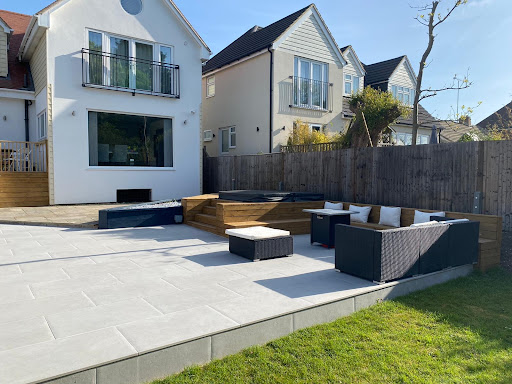 Complete back garden transformation, Porcelain paving, jacuzzi, full size alfresco bar, incorporated seating area and decking steps. Very proud of this project.