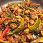 Spicy Sausage and Peppers Over Rice was pinched from <a href="http://allrecipes.com/Recipe/Spicy-Sausage-and-Peppers-Over-Rice/Detail.aspx" target="_blank">allrecipes.com.</a>