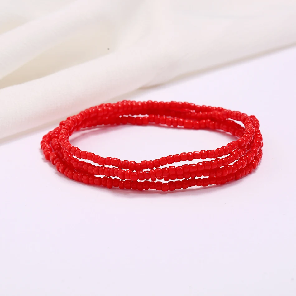 Ceinture femme colorée à perles avec taille élastique et chaîne, un accessoire idéal pour affiner la silhouette et ajouter une touche d'éclat.