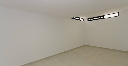 Empty room with high windows in this luxury property for sale in Dehesa de Campoamor ($1,313,234 - 239 m²)