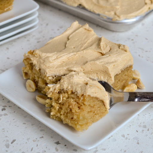 A delicious moist and easy Peanut Butter Cake with a luxuriously creamy peanut butter frosting.  This is the ultimate peanut butter lovers dessert and a must make.