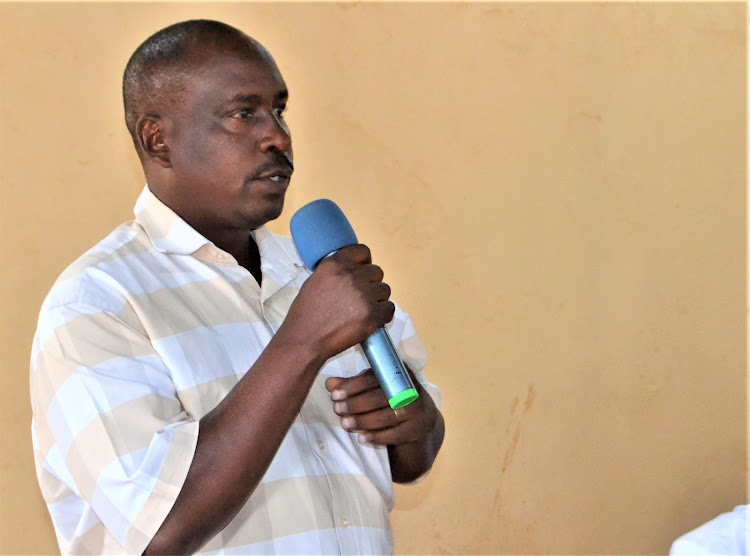 Ndengu farmer Paul Kyule, who is also the Mutomo market traders chairperson making his presentation during the public participation forum at Mutomo on Saturday.