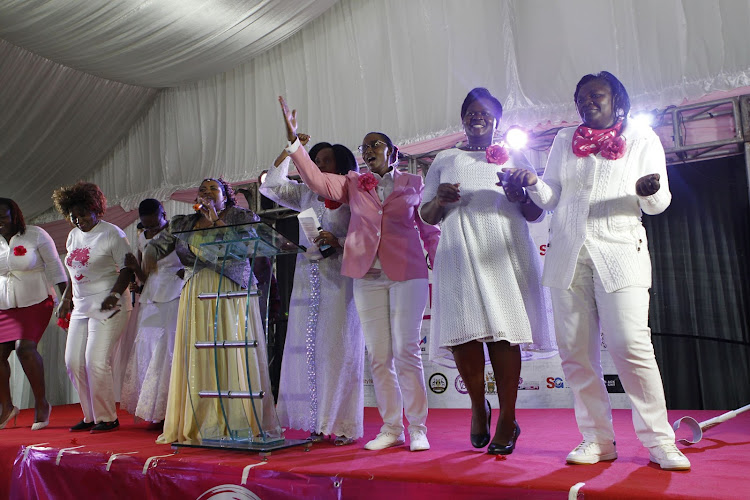 Women lawmakers dance on stage