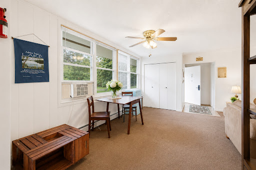 Dining area with table, chairs, windows - Luxury apartment / penthouse for sale in Warrensburg, 2 bedrooms