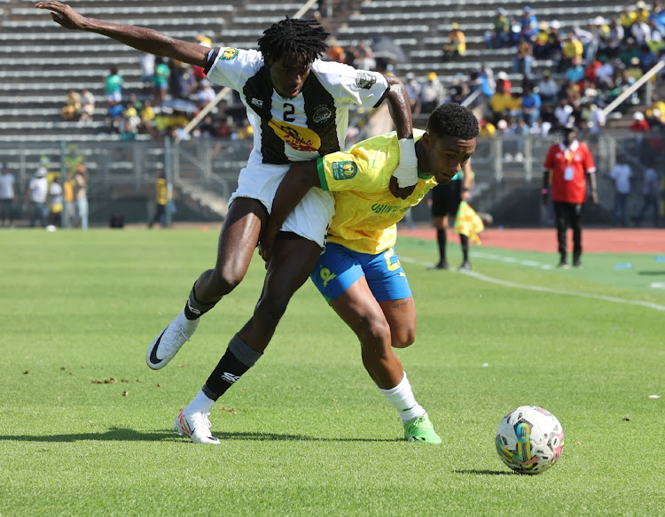 Mamelodi Sundowns player Lucas Ribeiro fights for ball possession with TP Mazembe player Ibrahima Keita during their Caf Champions League Group A match at Lucas Moripe Stadium in Pretoria on Sunday.