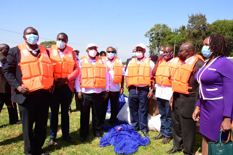 Fish farmers’ representatives receive life saver jackets from the Aquaculture Business Development Programme (ABDP), county and national government officials during the Annual Aquaculture Day celebrations in Nyeri