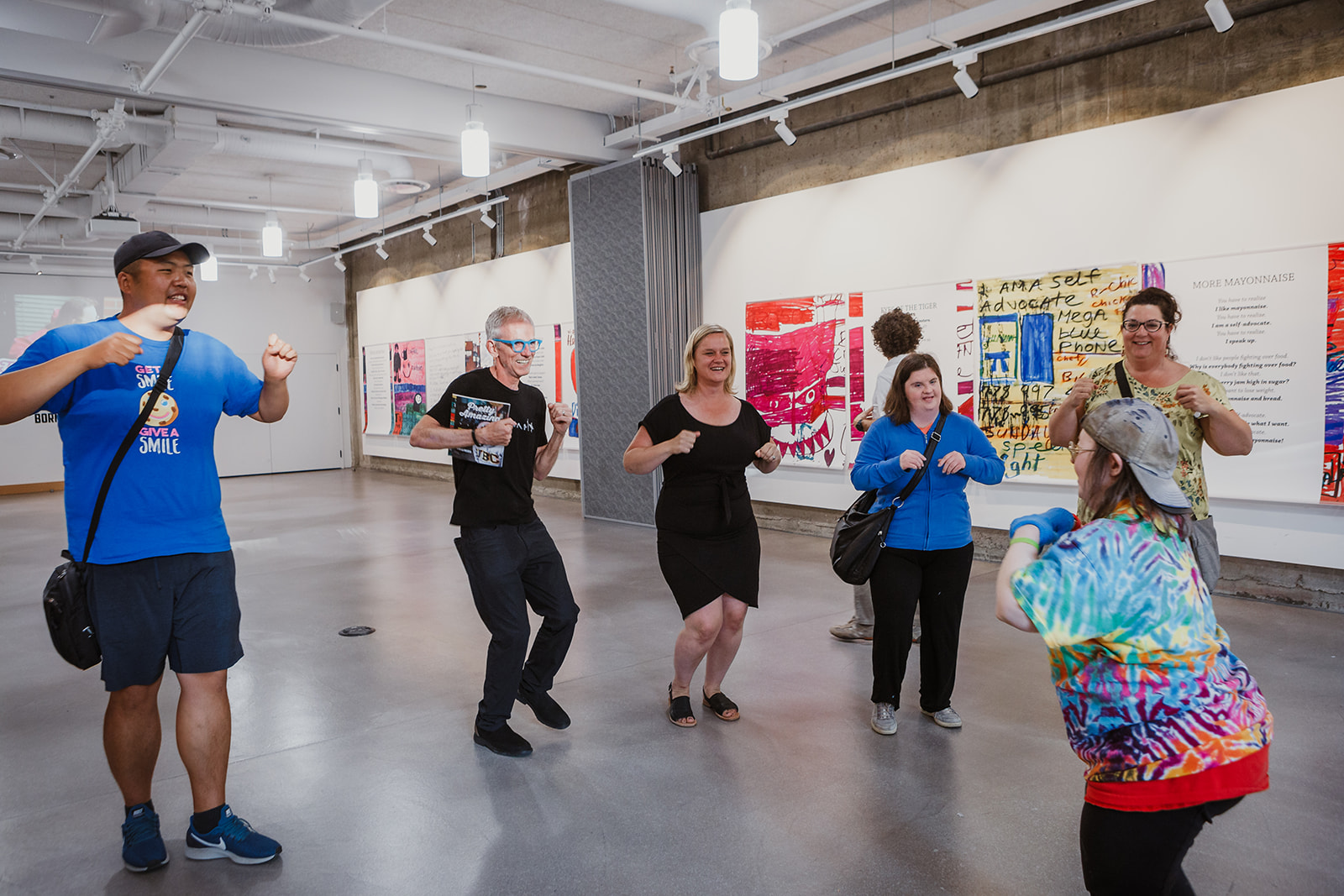 There is laughter and smiles as Teresa leads a group of friends in doing her signature chicken dance. Photo: This Is It Studios.