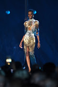 Miss SA Zozibini Tunzi wears a custom Biji La Maison de Couture gown on the Miss Universe stage.