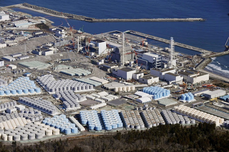 An aerial view shows the storage tanks for treated water at the tsunami-crippled Fukushima Daiichi nuclear power plant in Okuma town, Fukushima prefecture, Japan, in this February 13 2021 file photo. Picture taken February 13, 2021. KYODO via REUTERS