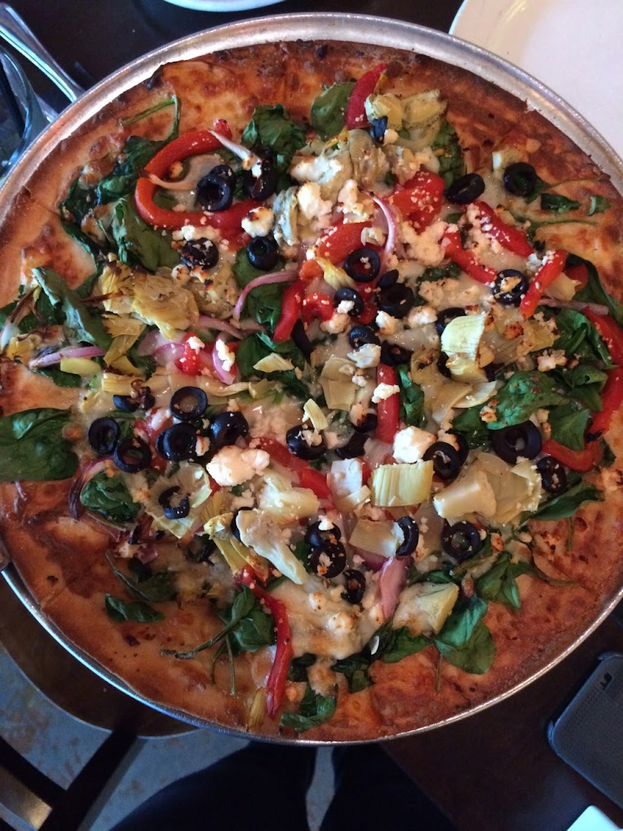 Now that I left I forgot the name of this pizza. But it was a white pizza: with red peppers, black olives, artichokes, spinach, red onion, and feta cheese