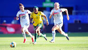 Banyana stars like Thembi Kgatlana, in action here against Lea Schueller of Germany, could play the World Cup at home. 