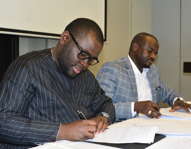 Bolorims.com CEO Michael Tokunbo Orimobil and African Sokoni CEO Ebrima Fatty sign an agreement