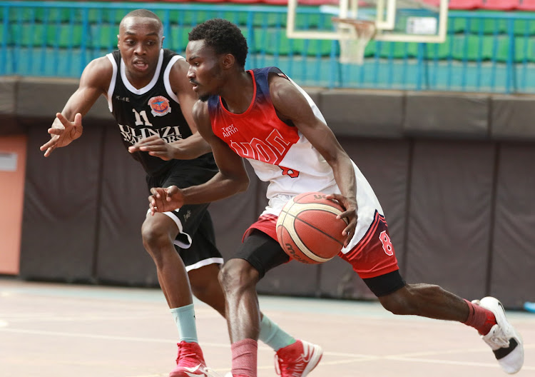 Ulinzi Warriors' Eric Mutoro tries to stop UoN Terrorists' Samuel Otieno during a past KBF league clash