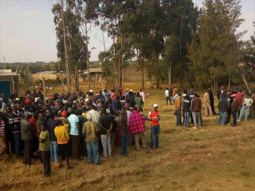 Residents of Kipkorgot, near Eldoret town, mill around the area where the bodies of athlete Richard Tirop and his friend Martin Kimutai were found, January 25, 2018. /Mathews Ndanyi