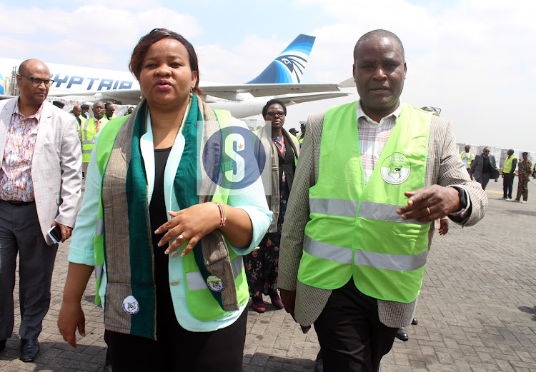 IEBC Vice-Chairperson Juliana Cherera and a commissioner Francis Wanderi arrive to receive the first batch of presidential ballot papers at JKIA on July 27, 2022