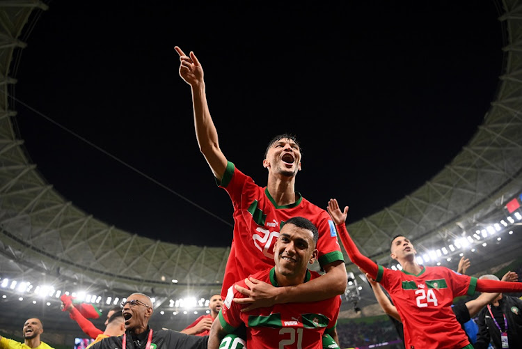 Achraf Dari and Walid Cheddira of Morocco celebrate their 1-0 World Cup quarterfinal win against Portugal at Al Thumama Stadium in Doha, Qatar on December 10 2022.