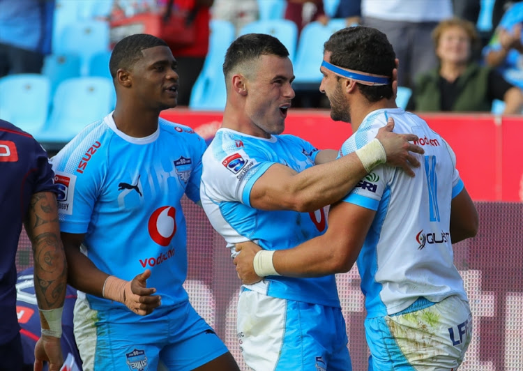 Jesse Kriel of the Vodacom Bulls congratulates Divan Rossouw after scoring his try during the Super Rugby match against the Rebels at Loftus Versfeld on April 21, 2018 in Pretoria, South Africa.