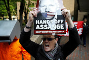 People protest outside Southwark Crown Court where WikiLeaks founder Julian Assange will be sentenced, in London, Britain, May 1, 2019. 
